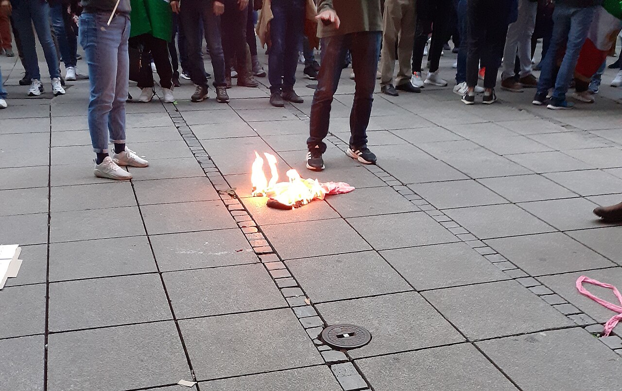 Burning hijab at a Mahsa Amini protest in Stuttgart