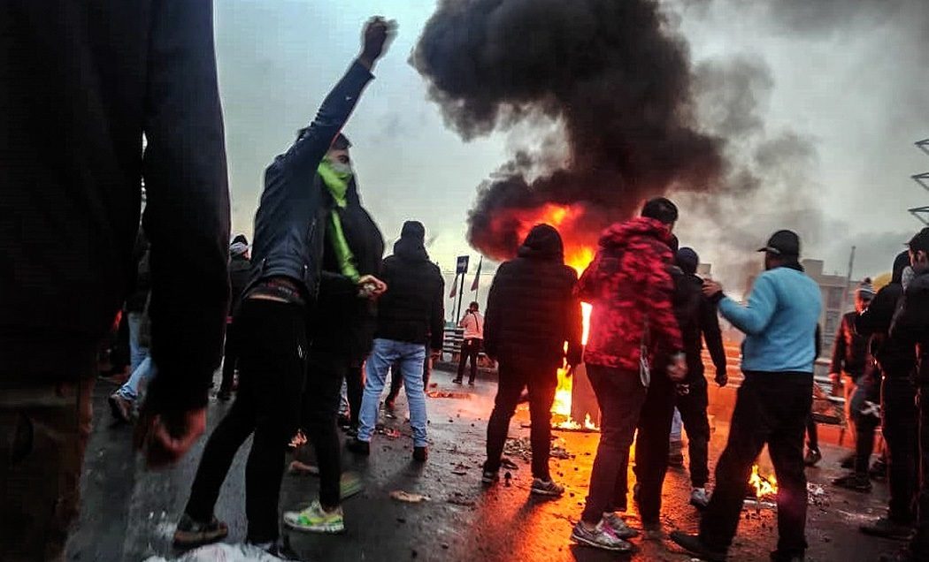 A gas station ablaze during Iran's November 2019 fuel-price protests.