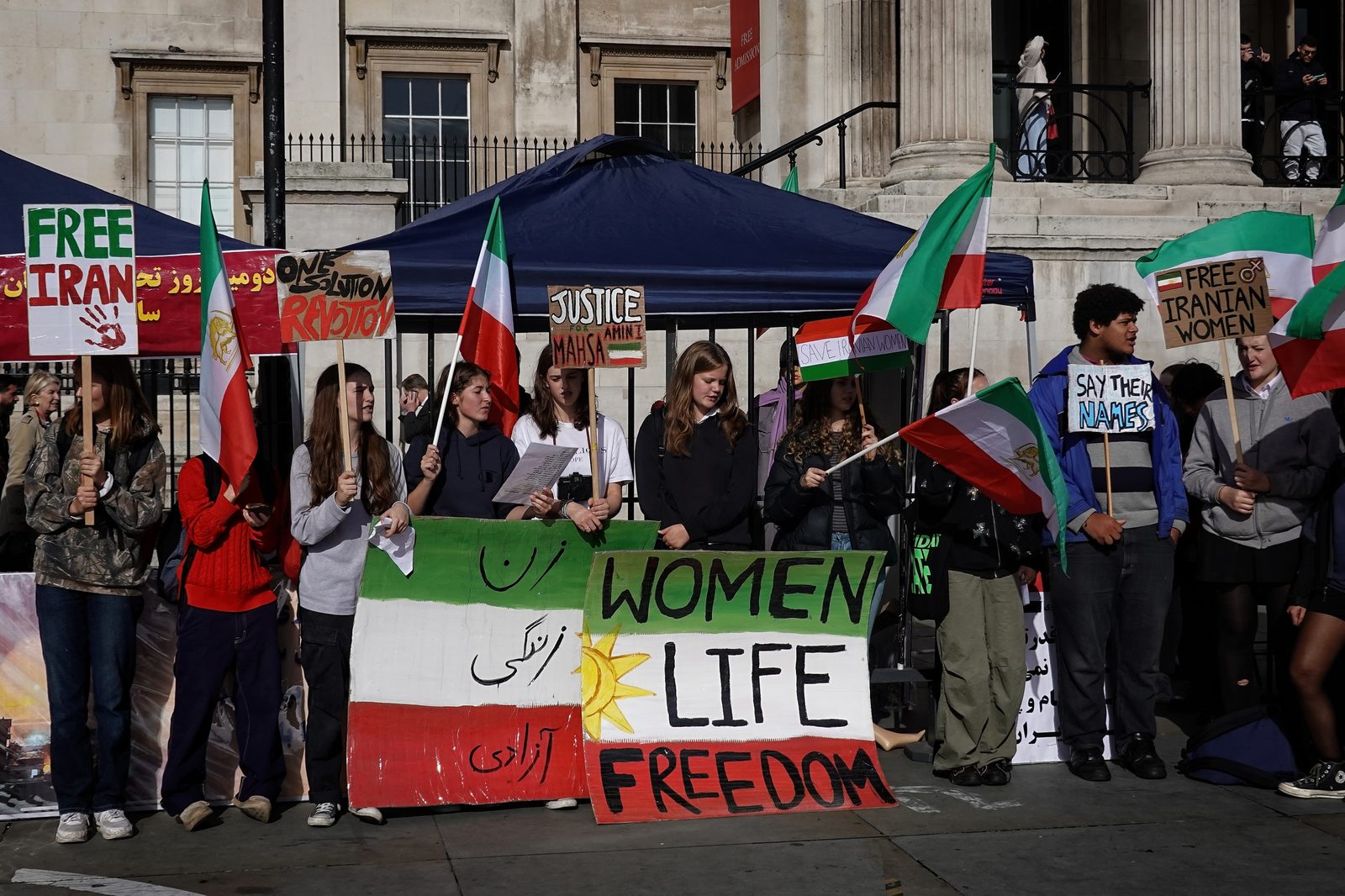 A London protester holds a sign reading Down with the Islamic Republic, October 2022.