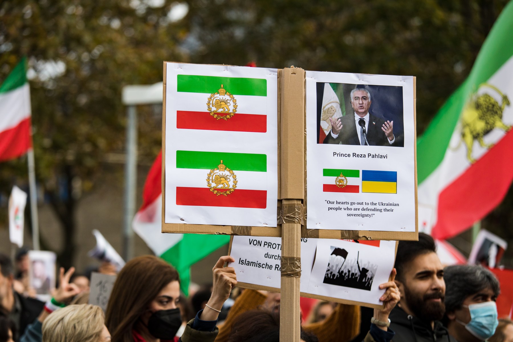Iranian diaspora protesters in Cologne, Germany, on 5 November 2022 hold a banner of Reza Pahlavi reading 'Bei dir sind wir unsterblich' ('with you we are undying'), at the Marsch für die Freiheit.