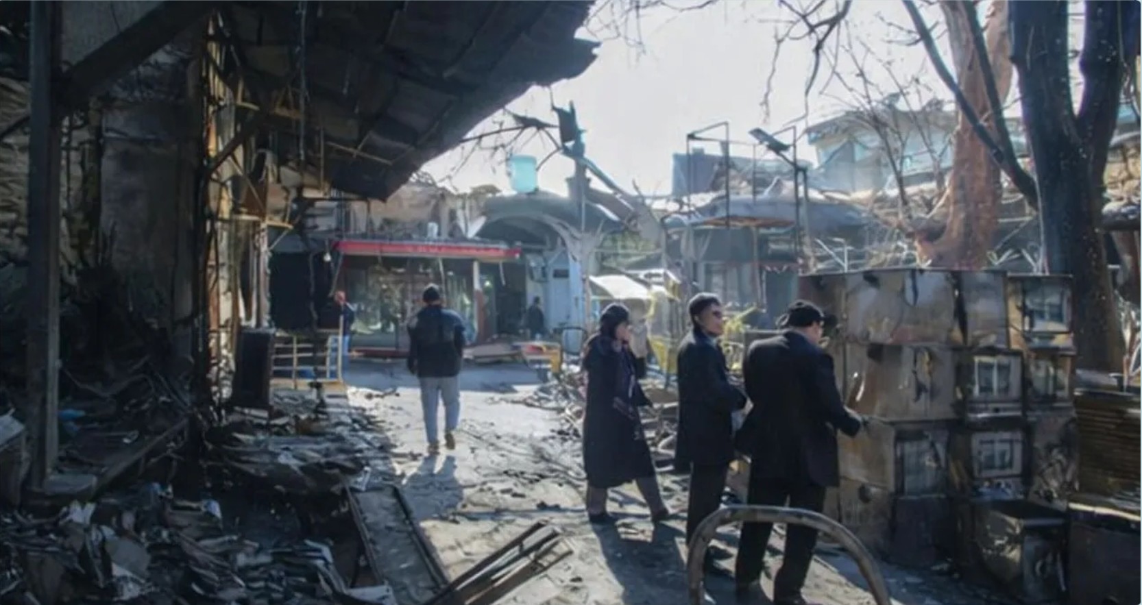 Additional visual evidence from Rasht's bazaar — interior corridors after the fire and live-fire assault.